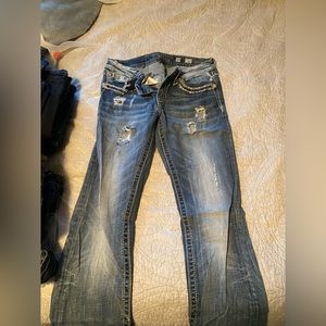 Miss me size 29; worn with minor holes in pants, ends of pants worn